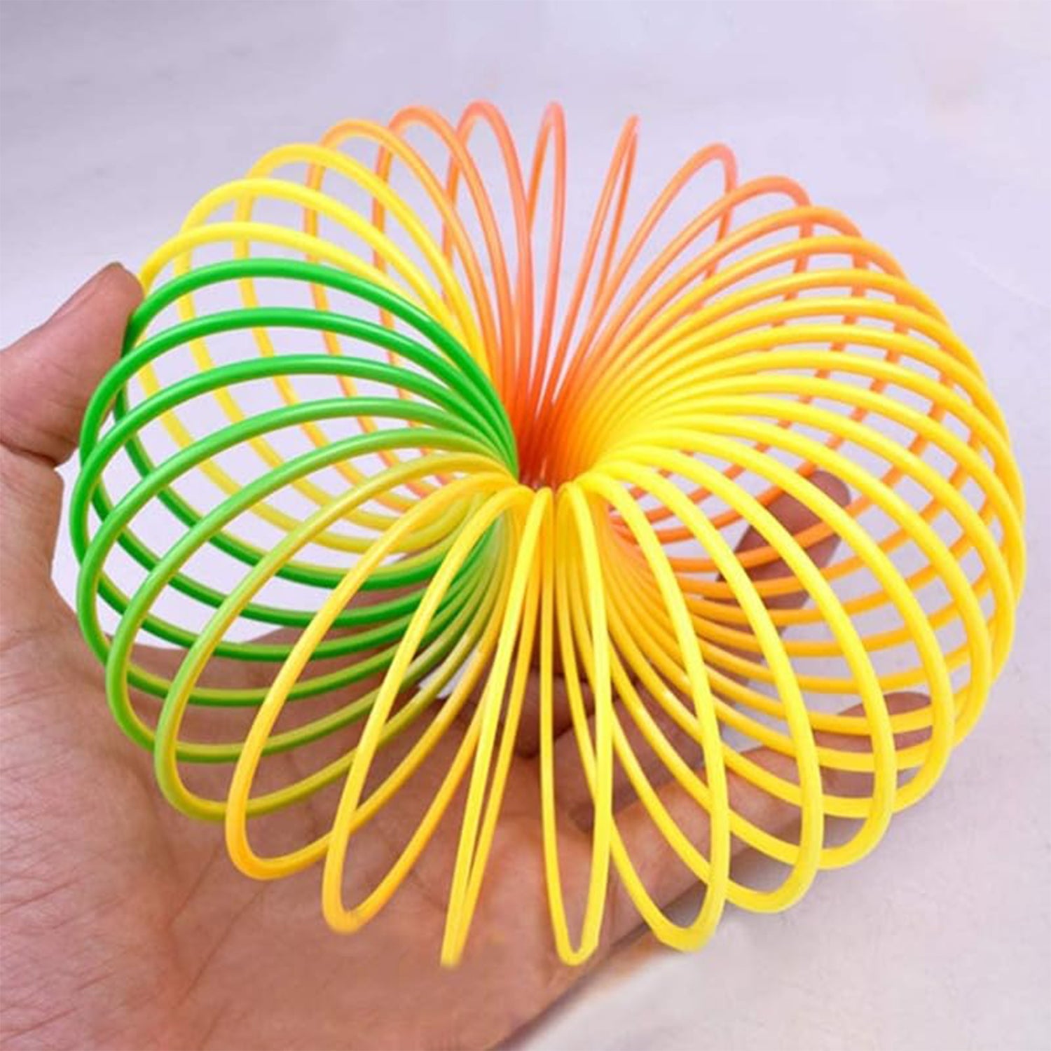 Rainbow Spring, Rainbow Spring Toys, Slinky, Slinky Spring Toy, Toy for Kids, for Kids Adults of All Age Group, for Birthdays, Compact and Portable Easy to Carry (1 Pc) - Bhavnagar Deodap